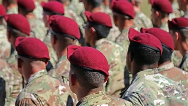 Who wears red berets?